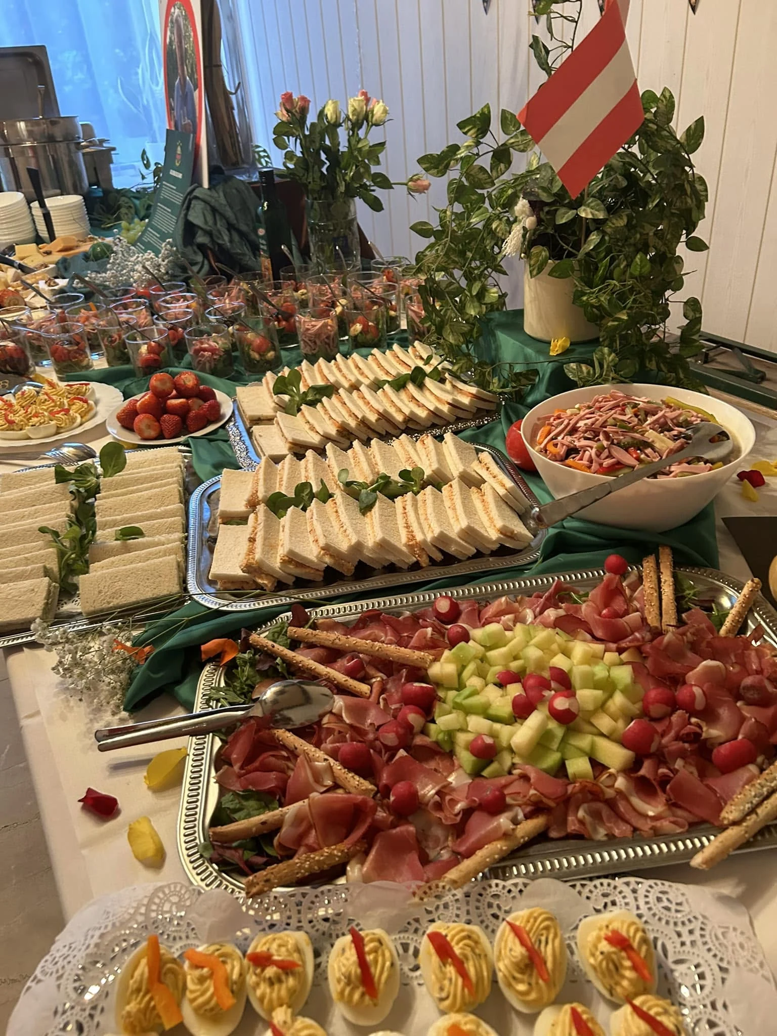 Catering buffet with sandwiches, antipasti and cold dishes
